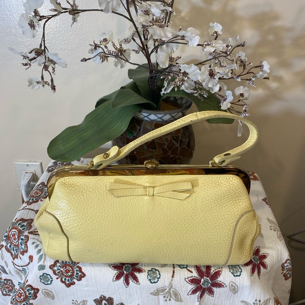Vintage leather clutch bag in canary yellow